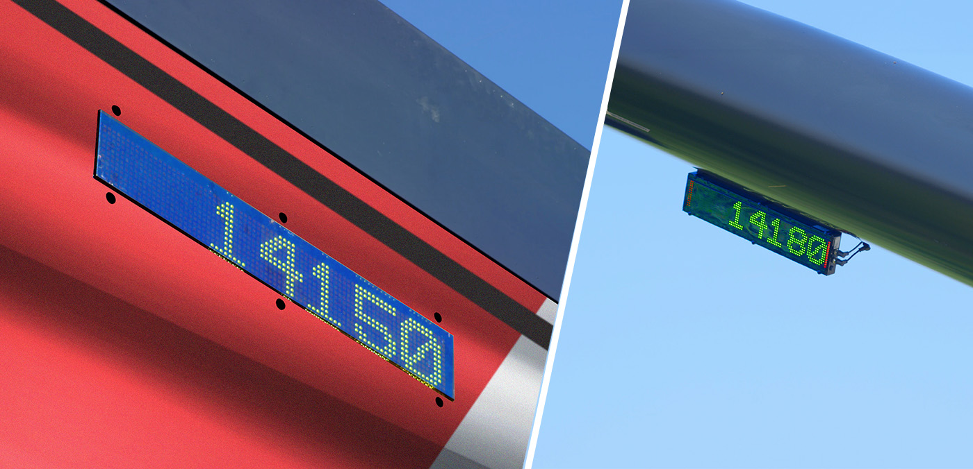 Photo showing both led scoreboard displays on a J&M grain cart